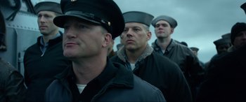 Movie still from “Greyhound” (2020), directed by Aaron Schneider – A group of men standing next to each other; Close Up shot, Low angle