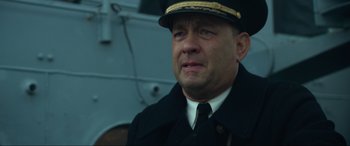 Movie still from “Greyhound” (2020), directed by Aaron Schneider – A person wearing a uniform; Close Up shot, Low angle