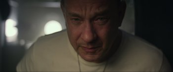 Movie still from “Greyhound” (2020), directed by Aaron Schneider – A man's face in a dark room; Close Up shot, Low angle