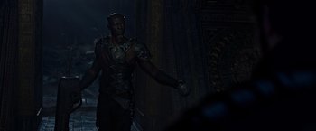 Movie still from “Guardians of the Galaxy” (2014), directed by James Gunn – A man in a leather outfit holding something in his hand; Medium shot, Low angle