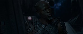 Movie still from “Guardians of the Galaxy” (2014), directed by James Gunn – A man in a black and silver costume; Close Up shot, Over the shoulder angle