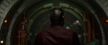 Movie still from “Guardians of the Galaxy” (2014), directed by James Gunn – A man in a red jacket wearing a helmet; Medium shot, Over the shoulder angle