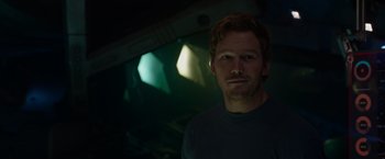 Movie still from “Guardians of the Galaxy” (2014), directed by James Gunn – A person wearing a t - shirt; Close Up shot, Over the shoulder angle