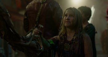 Movie still from “Guardians of the Galaxy” (2014), directed by James Gunn – A young girl holding a snake in her hand; Close Up shot, Low angle