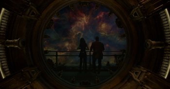 Movie still from “Guardians of the Galaxy” (2014), directed by James Gunn – Two people standing on a bridge looking at the sky; Wide shot, Overhead angle
