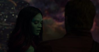 Movie still from “Guardians of the Galaxy” (2014), directed by James Gunn – A person wearing a green mask; Close Up shot, Over the shoulder angle