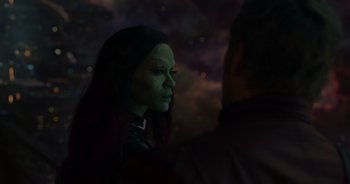 Movie still from “Guardians of the Galaxy” (2014), directed by James Gunn – A woman with a green face is standing next to a man; Close Up shot, Over the shoulder angle