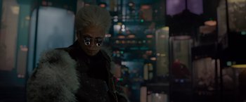 Movie still from “Guardians of the Galaxy” (2014), directed by James Gunn – A man in a white wig and fur jacket; Medium shot, Over the shoulder angle