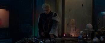 Movie still from “Guardians of the Galaxy” (2014), directed by James Gunn – A man in a costume looking in a mirror; Medium shot, Over the shoulder angle