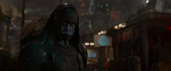 Movie still from “Guardians of the Galaxy” (2014), directed by James Gunn – A man in a costume is standing in a dark room; Close Up shot, Over the shoulder angle