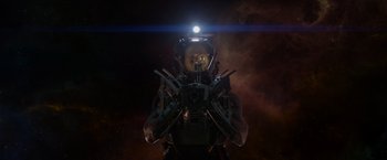 Movie still from “Guardians of the Galaxy” (2014), directed by James Gunn – A man in a space suit is holding a gun; Medium shot, Low angle