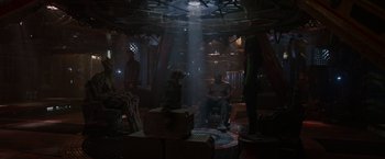 Movie still from “Guardians of the Galaxy” (2014), directed by James Gunn – A group of people standing around in a room; Wide shot, Over the shoulder angle