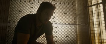 Movie still from “Guardians of the Galaxy” (2014), directed by James Gunn – A man with a beard is listening to music; Close Up shot, Over the shoulder angle