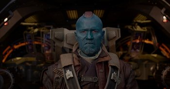 Movie still from “Guardians of the Galaxy” (2014), directed by James Gunn – An image of a man with a blue face; Close Up shot, Over the shoulder angle