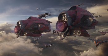 Movie still from “Guardians of the Galaxy” (2014), directed by James Gunn – A group of red and black jets flying through the sky; Extreme Wide shot, Low angle