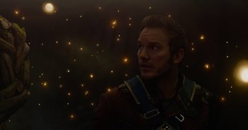 Movie still from “Guardians of the Galaxy” (2014), directed by James Gunn – A man in a harness looking up at the stars; Close Up shot, Low angle
