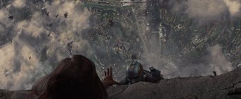 Movie still from “Guardians of the Galaxy” (2014), directed by James Gunn – A person sitting on top of a hill looking at a city; Extreme Wide shot, Overhead angle
