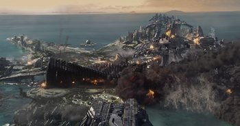 Movie still from “Guardians of the Galaxy” (2014), directed by James Gunn – An aerial view of a city being destroyed by an air strike; Extreme Wide shot, High angle