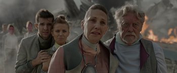 Movie still from “Guardians of the Galaxy” (2014), directed by James Gunn – A group of people that are standing in the dirt; Close Up shot, Over the shoulder angle