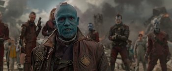 Movie still from “Guardians of the Galaxy” (2014), directed by James Gunn – A group of people standing next to each other in a field; Close Up shot, Over the shoulder angle