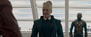 Movie still from “Guardians of the Galaxy” (2014), directed by James Gunn – A woman with blonde hair is smiling for the camera; Medium shot, Low angle