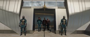 Movie still from “Guardians of the Galaxy” (2014), directed by James Gunn – A group of people in a room with a star on the wall; Wide shot, Low angle