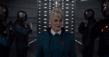 Movie still from “Guardians of the Galaxy” (2014), directed by James Gunn – A woman with blonde hair in a blue suit; Medium shot, Over the shoulder angle