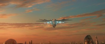 Movie still from “Guardians of the Galaxy Vol. 2” (2017), directed by James Gunn – An image of an airplane flying in the sky at sunset; Extreme Wide shot, Low angle