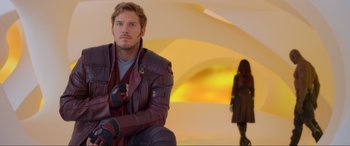 Movie still from “Guardians of the Galaxy Vol. 2” (2017), directed by James Gunn – A man and a woman are standing in a room together; Medium shot, Over the shoulder angle