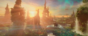 Movie still from “Guardians of the Galaxy Vol. 2” (2017), directed by James Gunn – Two people are standing on a bridge in front of a beautiful sunset; Extreme Wide shot, High angle