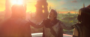 Movie still from “Guardians of the Galaxy Vol. 2” (2017), directed by James Gunn – An older man with a long white beard is holding his hand out to someone; Medium shot, Low angle
