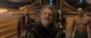Movie still from “Guardians of the Galaxy Vol. 2” (2017), directed by James Gunn – A man with long grey hair and a gray beard; Close Up shot, Over the shoulder angle