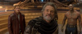 Movie still from “Guardians of the Galaxy Vol. 2” (2017), directed by James Gunn – An older man with a beard and a gray beard; Close Up shot, Over the shoulder angle