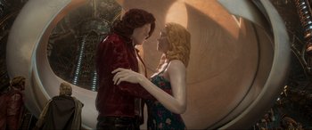 Movie still from “Guardians of the Galaxy Vol. 2” (2017), directed by James Gunn – A statue of a man and a woman holding hands; Medium shot, Low angle