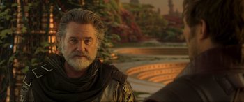 Movie still from “Guardians of the Galaxy Vol. 2” (2017), directed by James Gunn – An older man with long grey hair and a beard; Close Up shot, Over the shoulder angle