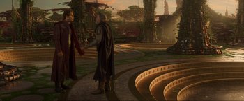 Movie still from “Guardians of the Galaxy Vol. 2” (2017), directed by James Gunn – Two people standing in a circle with a sunset in the background; Wide shot, High angle