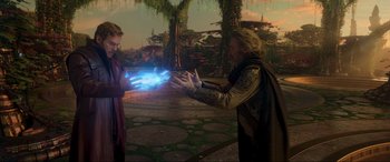 Movie still from “Guardians of the Galaxy Vol. 2” (2017), directed by James Gunn – A man is holding something in his hand and another man is holding something in his hand; Medium shot, Over the shoulder angle