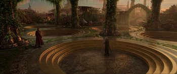 Movie still from “Guardians of the Galaxy Vol. 2” (2017), directed by James Gunn – A man standing in a circle in front of a forest; Extreme Wide shot, High angle