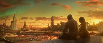 Movie still from “Guardians of the Galaxy Vol. 2” (2017), directed by James Gunn – A man sitting on top of a building near a body of water; Extreme Wide shot, High angle