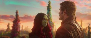 Movie still from “Guardians of the Galaxy Vol. 2” (2017), directed by James Gunn – A woman and a man standing next to each other in front of trees; Close Up shot, Over the shoulder angle
