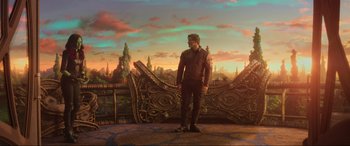 Movie still from “Guardians of the Galaxy Vol. 2” (2017), directed by James Gunn – A man standing in front of an elaborate mural; Wide shot, Over the shoulder angle
