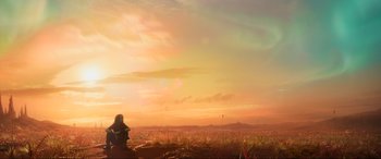 Movie still from “Guardians of the Galaxy Vol. 2” (2017), directed by James Gunn – A woman sitting on a bench in a field; Extreme Wide shot, Low angle