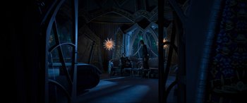 Movie still from “Guardians of the Galaxy Vol. 2” (2017), directed by James Gunn – A man and a woman are sitting on a couch in a dark room; Extreme Wide shot, High angle