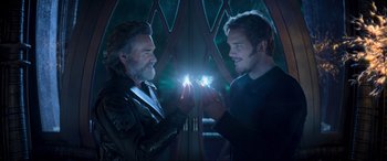 Movie still from “Guardians of the Galaxy Vol. 2” (2017), directed by James Gunn – Two men are holding their cell phones in their hands; Close Up shot, Over the shoulder angle