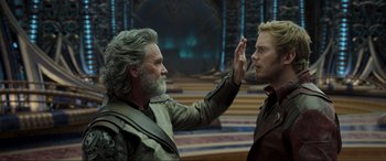 Movie still from “Guardians of the Galaxy Vol. 2” (2017), directed by James Gunn – A man and a woman are holding their hands up in the air; Close Up shot, Over the shoulder angle