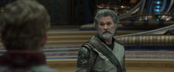 Movie still from “Guardians of the Galaxy Vol. 2” (2017), directed by James Gunn – An older man with grey hair and a gray beard; Medium shot, Over the shoulder angle