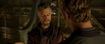 Movie still from “Guardians of the Galaxy Vol. 2” (2017), directed by James Gunn – A man in a red jacket talking to another man in a red jacket; Close Up shot, Over the shoulder angle