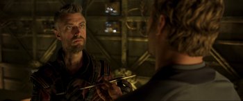 Movie still from “Guardians of the Galaxy Vol. 2” (2017), directed by James Gunn – A man looking at himself in the mirror while holding chopsticks in his hand; Close Up shot, Over the shoulder angle