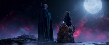 Movie still from “Guardians of the Galaxy Vol. 2” (2017), directed by James Gunn – Two men in space suits and one is sitting on a rock; Wide shot, Low angle