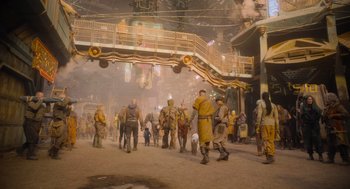 Movie still from “Guardians of the Galaxy Vol. 3” (2023), directed by James Gunn – A group of people walking on a dirt road; Wide shot, Low angle